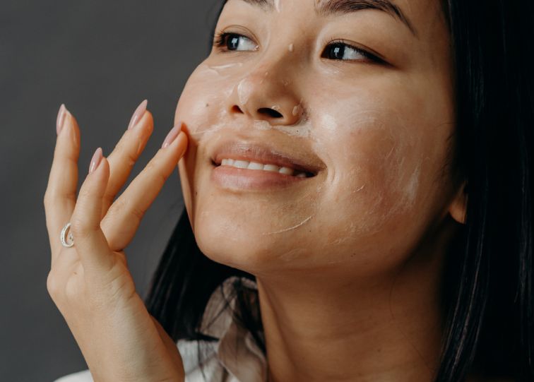 Girl exfoliating face