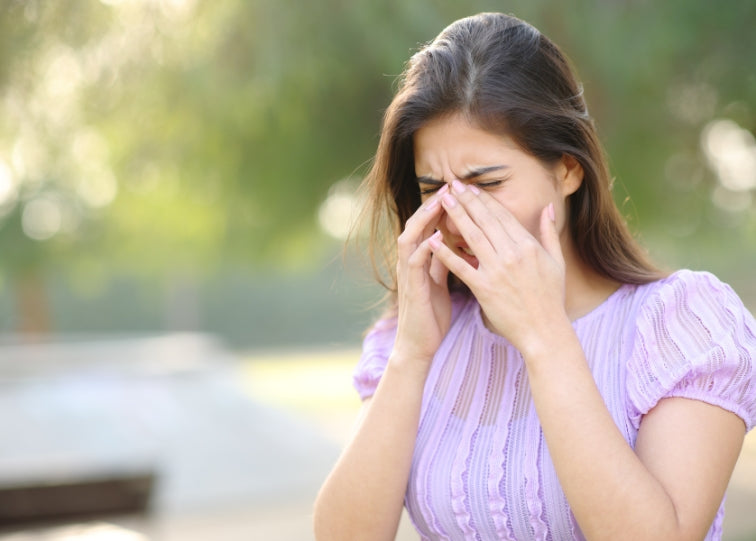 Woman scratching eyes